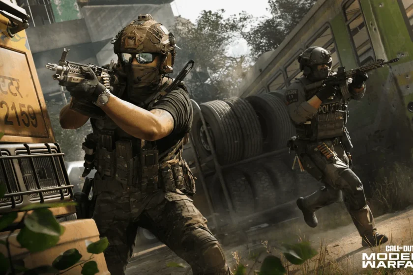 A multiplayer operator aims a pistol beside a bus while another operator moves behind him.