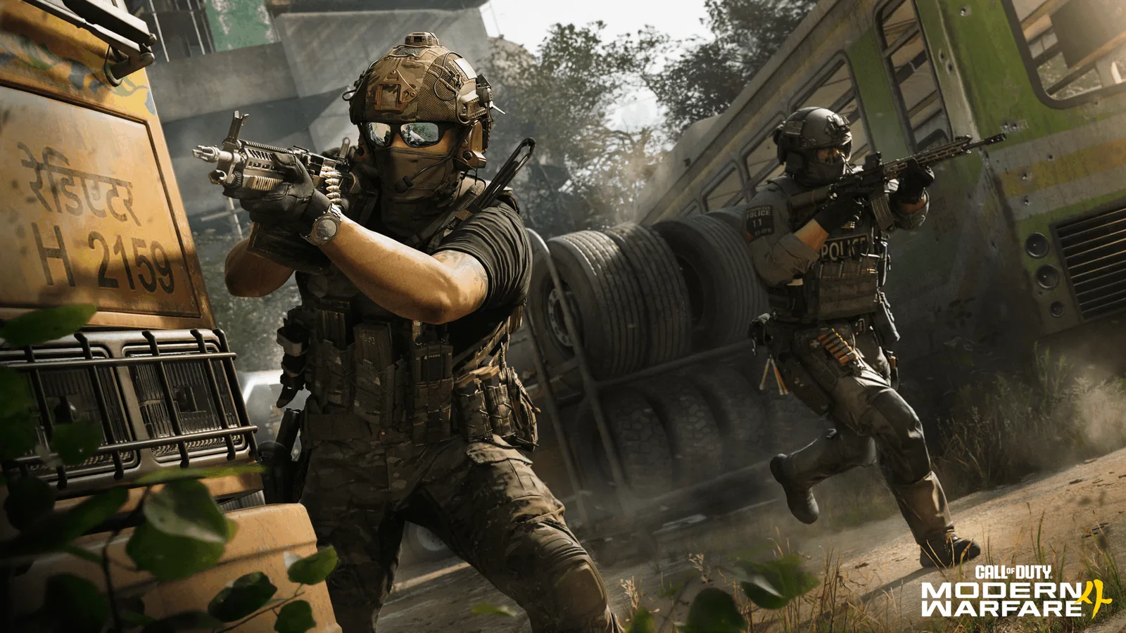 A multiplayer operator aims a pistol beside a bus while another operator moves behind him.