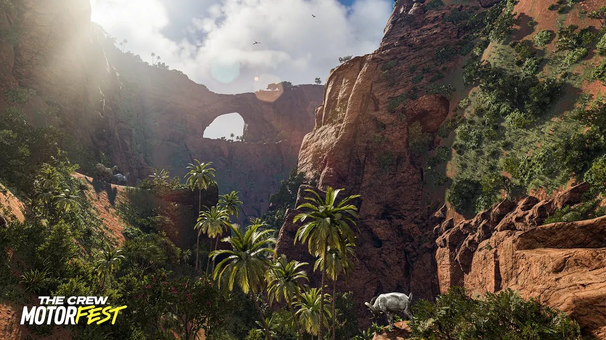 A red canyon, tropical vegetation and wild goats in an official The Crew Motorfest screenshot.